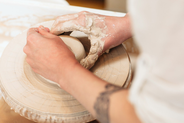 Potter hands shaping clay top view - Φωτογραφία, εικόνα