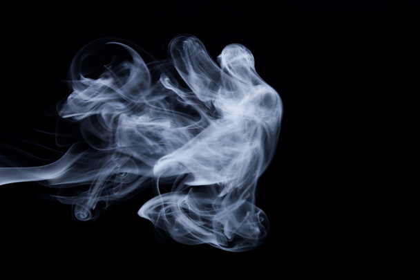 Cloud of smoke on black background. Selective focus - Zdjęcie, obraz