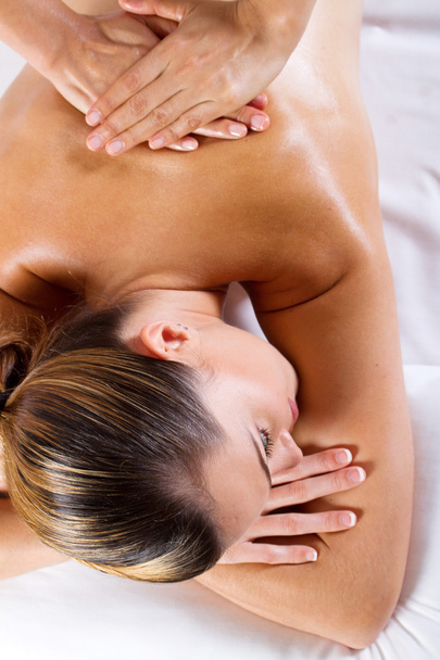 Young woman receiving back massage - Zdjęcie, obraz