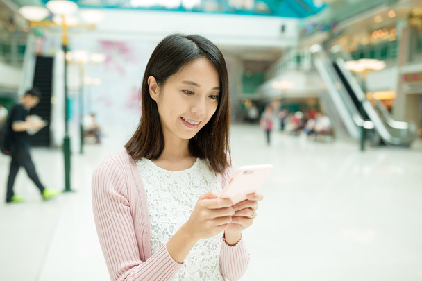 Asian woman using mobile phone - Photo, image