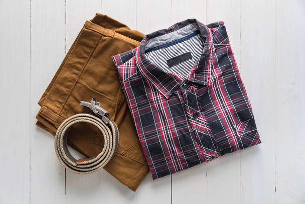 Flat lay of men's casual  fashion on wooden floor - Foto, Imagem