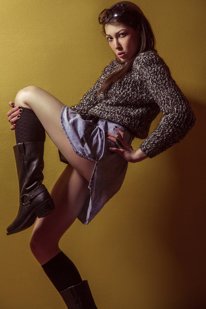 Mixed race sexy fashion model posing on stepladder. - Photo, image