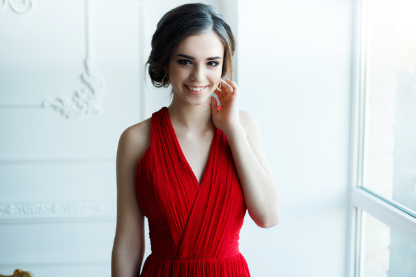beautiful lady in red dress with an evening make-up - Фото, зображення