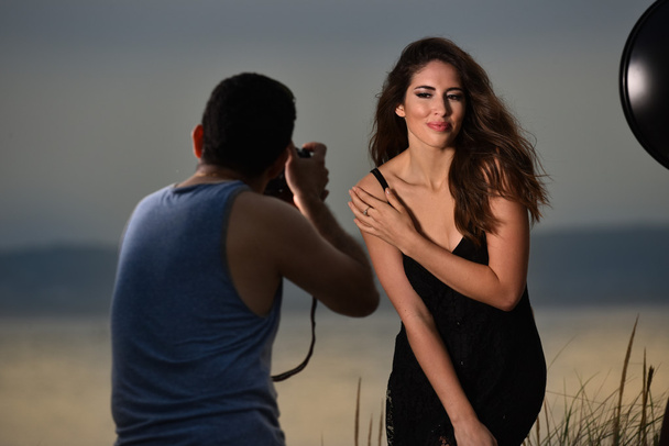 Photographer shooting beautiful brunette - Fotografie, Obrázek