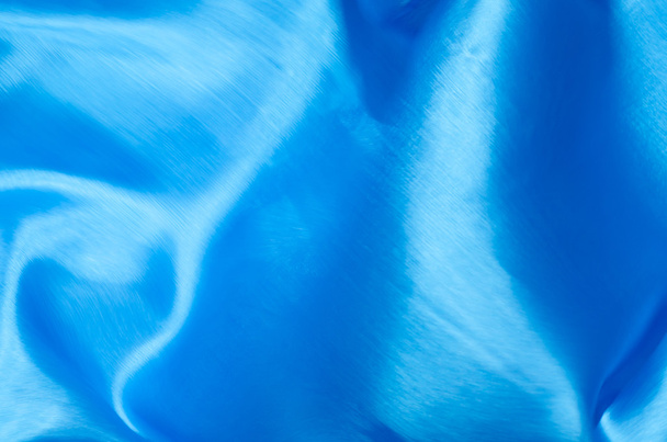 motion blurred blue silk texture background - Foto, afbeelding