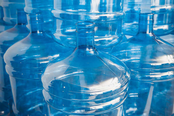 Big empty water bottles at warehouse - Foto, Imagen