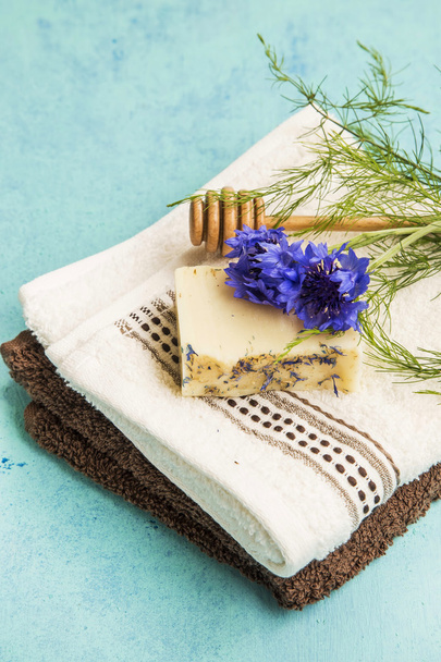 Spa natural soap with cornflower and towels - Valokuva, kuva