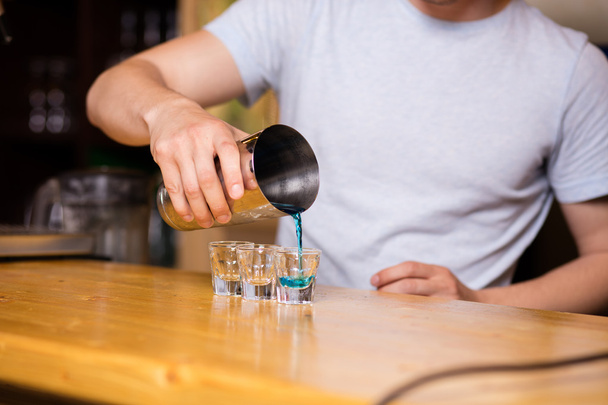 bartender preparing coktails in a pub - 写真・画像