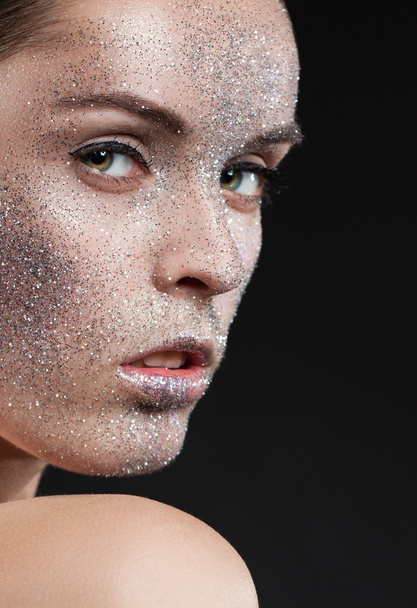 Beauty, fashion, make-up. Woman with glitter on her face. Beauty close-up portrait - Fotó, kép
