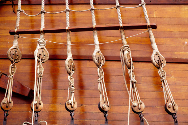 Ancient wooden sailboat pulleys and ropes - 写真・画像