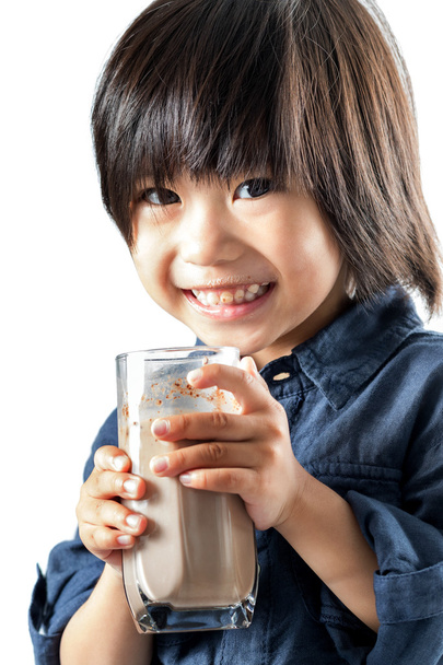 Cute asian youngster drinking chocolate milk. - Photo, Image