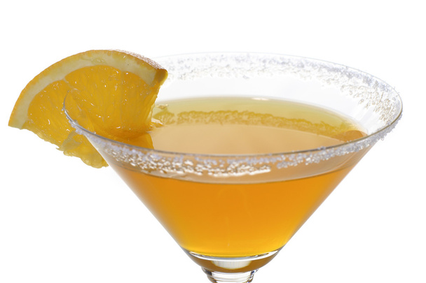 A photo of martini glass with orange cocktail and a piece of citrus - Photo, image