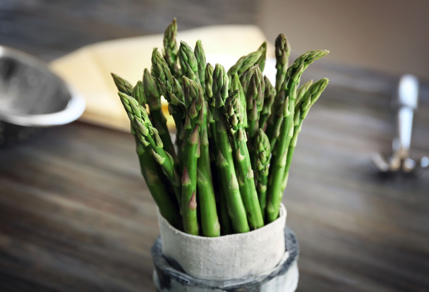 Asparagus in pot on table - 写真・画像
