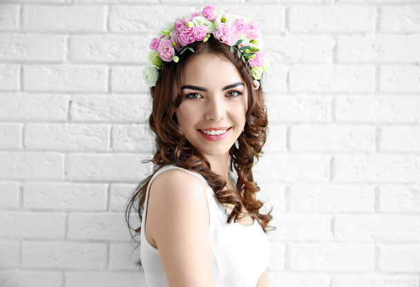 Beautiful young woman with flowers - Foto, imagen