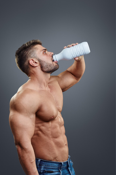 Sporty man drinking water - 写真・画像