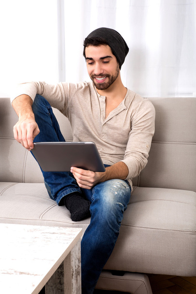 Young man using a tablet pc - Φωτογραφία, εικόνα