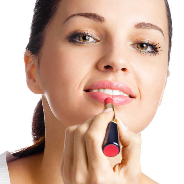 Woman applying lipstick, isolated - Foto, imagen