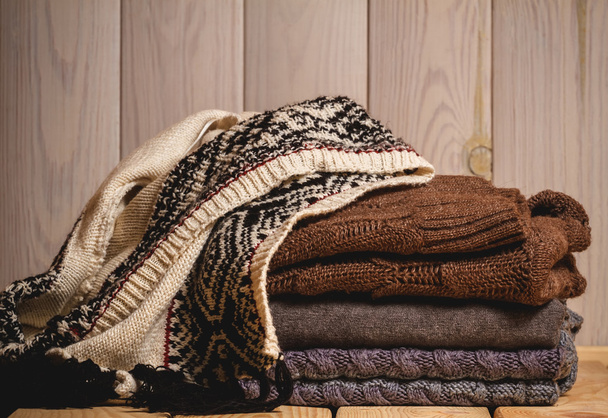 Pile of knitted sweaters - Фото, зображення