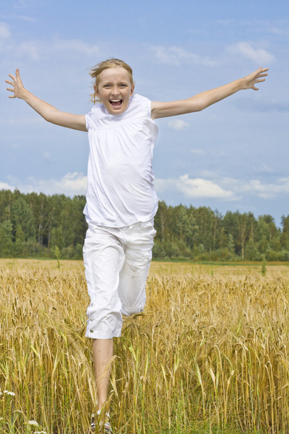 Teenager girl run happiness on meadow - 写真・画像