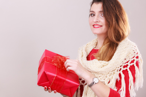 Girl checking out present.  - 写真・画像