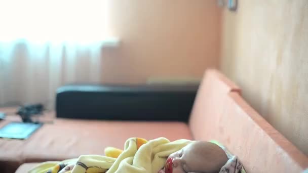 Close-up portrait of a beautiful sleeping baby on vintage suitcase - Imágenes, Vídeo