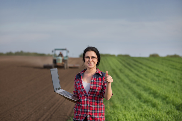 Woman showing thumb up in field - Photo, Image
