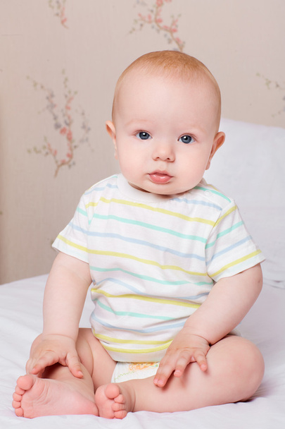 Child,baby happiness concept. Cute baby boy sits quietly on the  - Fotó, kép