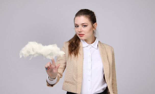 Young woman and cloud, cloud computing concept - Фото, изображение