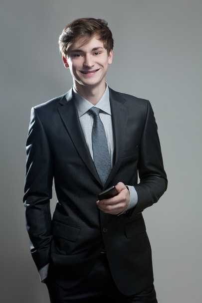 Young businessman using a mobile phone - Foto, afbeelding