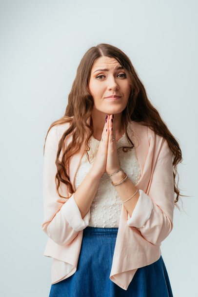 Young woman praying - Фото, изображение