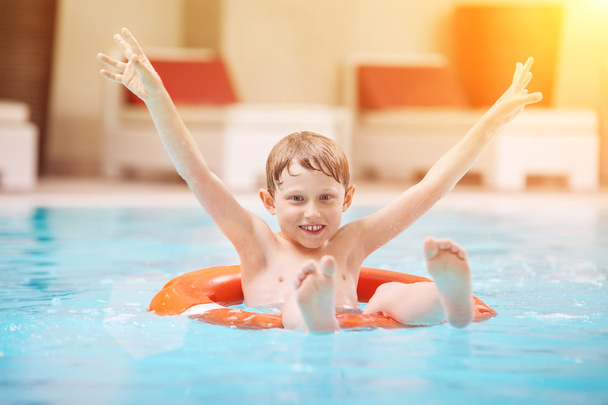 Happy boy swiming in pool - Photo, Image