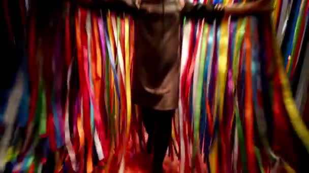 Beautiful girl goes through ribbons  - Filmati, video