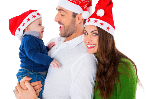 Padres felices con bebé niño usando sombreros de Santa
 - Foto, imagen