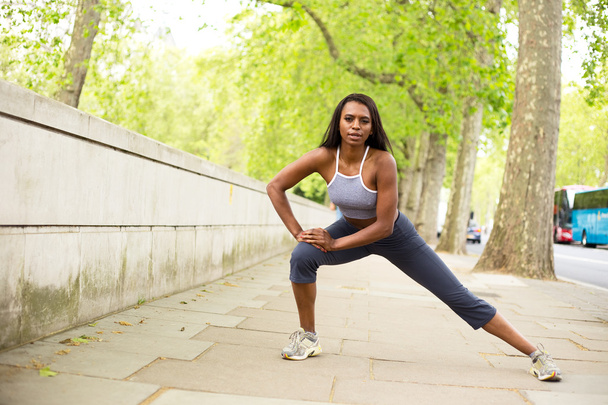 fitness woman stretching in the park - Fotó, kép