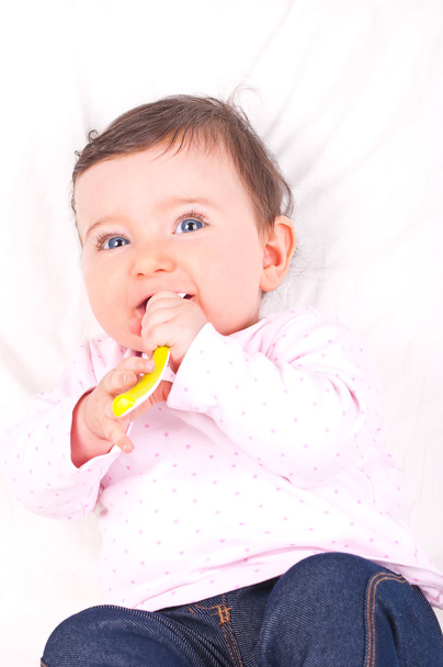 Baby girl with spoon. - Fotografie, Obrázek