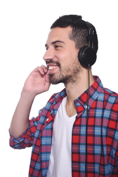 Young latin man listening to music  - Foto, imagen