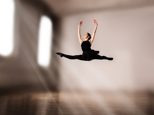 Woman dancer jump posing on background - Photo, Image