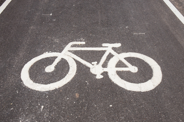 Closeup bicycle lane sign on road - Photo, Image