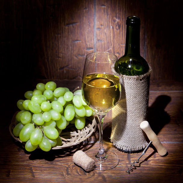 Wine bottles with glass on wooden background - Photo, Image