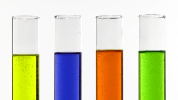test tubes with colored liquids abuzz - Footage, Video