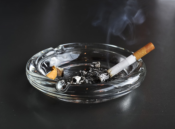 lit cigarette in the ashtray - Photo, Image
