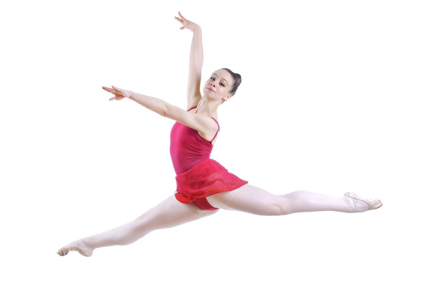 Beautiful artistic female ballerina working out, performing art ballet element - Фото, изображение