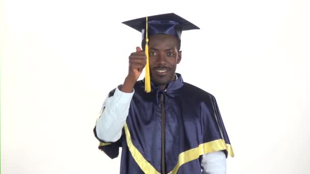 Male graduate shows thumb. White. Slow motion. Close up - Footage, Video