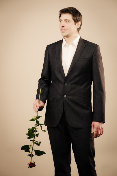 Handsome man with rose - Foto, Imagem