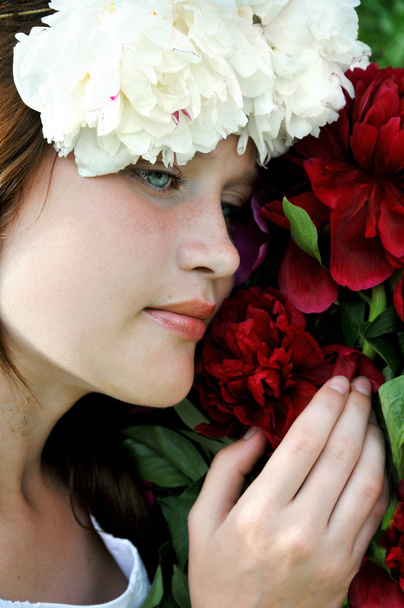 Young, romantic, beautiful girl with flowers . - Фото, зображення