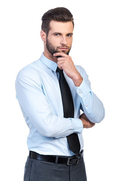 man in shirt and tie holding hand on chin - Fotoğraf, Görsel