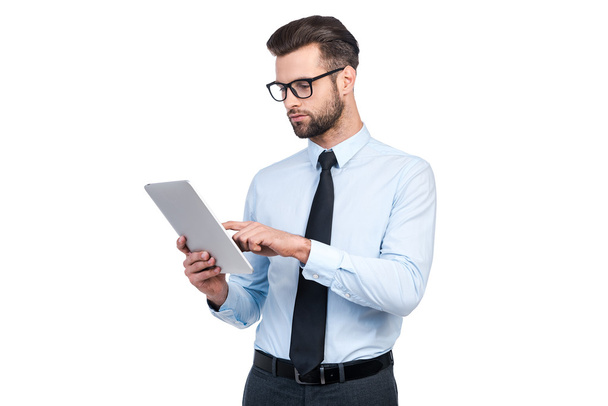 man in shirt and tie working on digital tablet - Фото, зображення