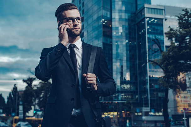 young man in full suit talking on the mobile phone - Photo, Image