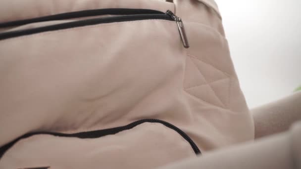 Woman hand zipping light sports bag - Filmati, video