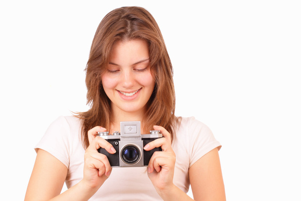Smiling young girl with an old camera - 写真・画像